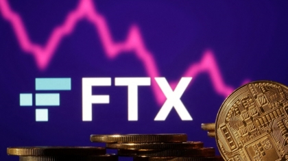 FILE PHOTO: Illustration shows FTX logo, stock graph and representation of cryptocurrencies