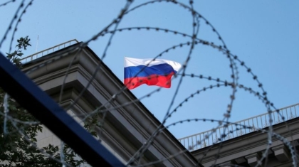 FILE PHOTO: A Russian national flag is seen at the roof of Russian embassy in Kiev