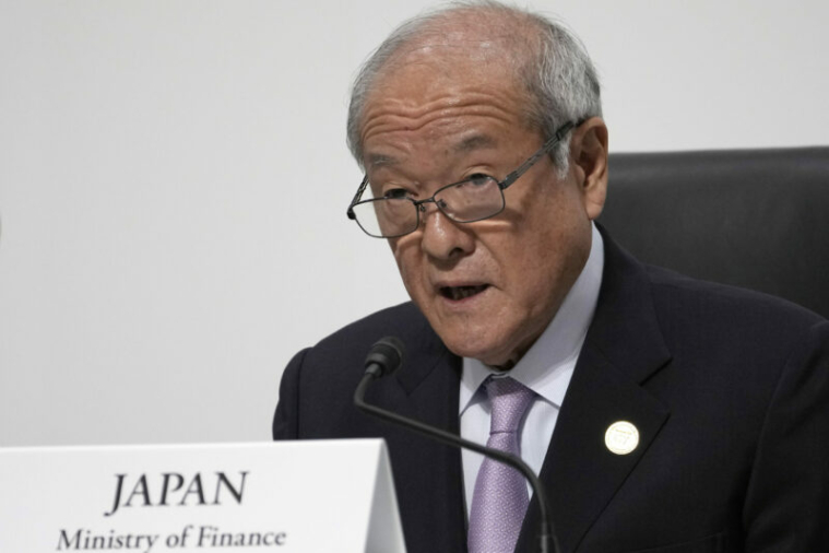 Japanese Finance Minister Shunichi Suzuki speaks during the presidency press conference at the G7 meeting of finance ministers and central bank governors, at Toki Messe in Niigata, Japan, Saturday, May 13, 2023. (AP Photo/Shuji Kajiyama, Pool)