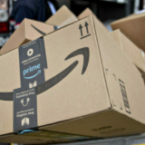 An Amazon.com Inc. package sits in a bin before being placed on a delivery vehicle at the United States Postal Service (USPS) Joseph Curseen Jr. and Thomas Morris Jr. processing and distribution center in Washington, D.C., U.S., on Tuesday, Dec. 12, 2017.  Photographer: Andrew Harrer/Bloomberg