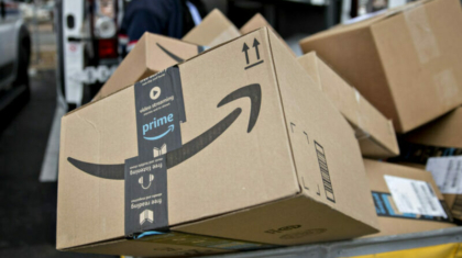 An Amazon.com Inc. package sits in a bin before being placed on a delivery vehicle at the United States Postal Service (USPS) Joseph Curseen Jr. and Thomas Morris Jr. processing and distribution center in Washington, D.C., U.S., on Tuesday, Dec. 12, 2017.  Photographer: Andrew Harrer/Bloomberg