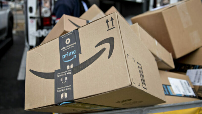 An Amazon.com Inc. package sits in a bin before being placed on a delivery vehicle at the United States Postal Service (USPS) Joseph Curseen Jr. and Thomas Morris Jr. processing and distribution center in Washington, D.C., U.S., on Tuesday, Dec. 12, 2017.  Photographer: Andrew Harrer/Bloomberg