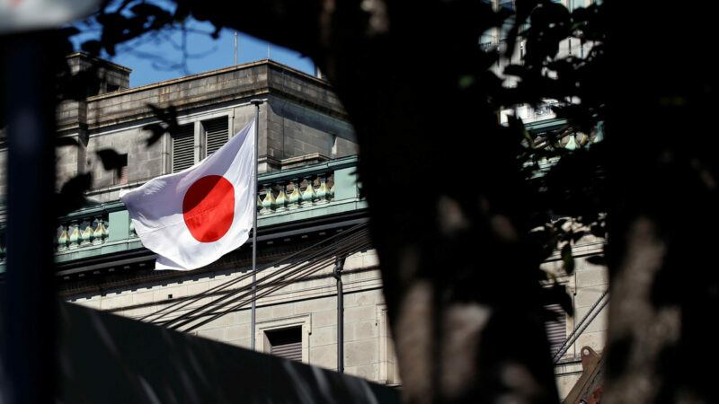 A Japanese flag flutters atop the Bank of Japan building under construction in Tokyo, Japan, September 21, 2017.   REUTERS/Toru Hanai