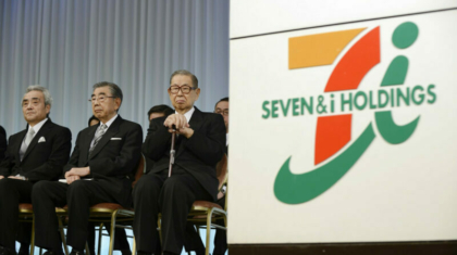 Noritoshi Murata, president and chief operating officer of Seven & I Holdings Co., left to right, Toshifumi Suzuki, chairman and chief executive officer, Masatoshi Ito, founder and honorary chairman, attend the company's initiation ceremony for new employees in Tokyo, Japan, on Thursday, March 13, 2014. Japanese labor unions said they clinched their biggest raises in years as Prime Minister Shinzo Abe calls for companies to boost wages to help put the worlds third-largest economy on a path to sustainable growth. Photographer: Akio Kon/Bloomberg via Getty Images