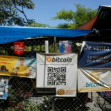 FILE PHOTO: Bitcoin banners are seen outside of a small restaurant at El Zonte Beach in Chiltiupan, El Salvador June 8, 2021. REUTERS/Jose Cabezas/File Photo