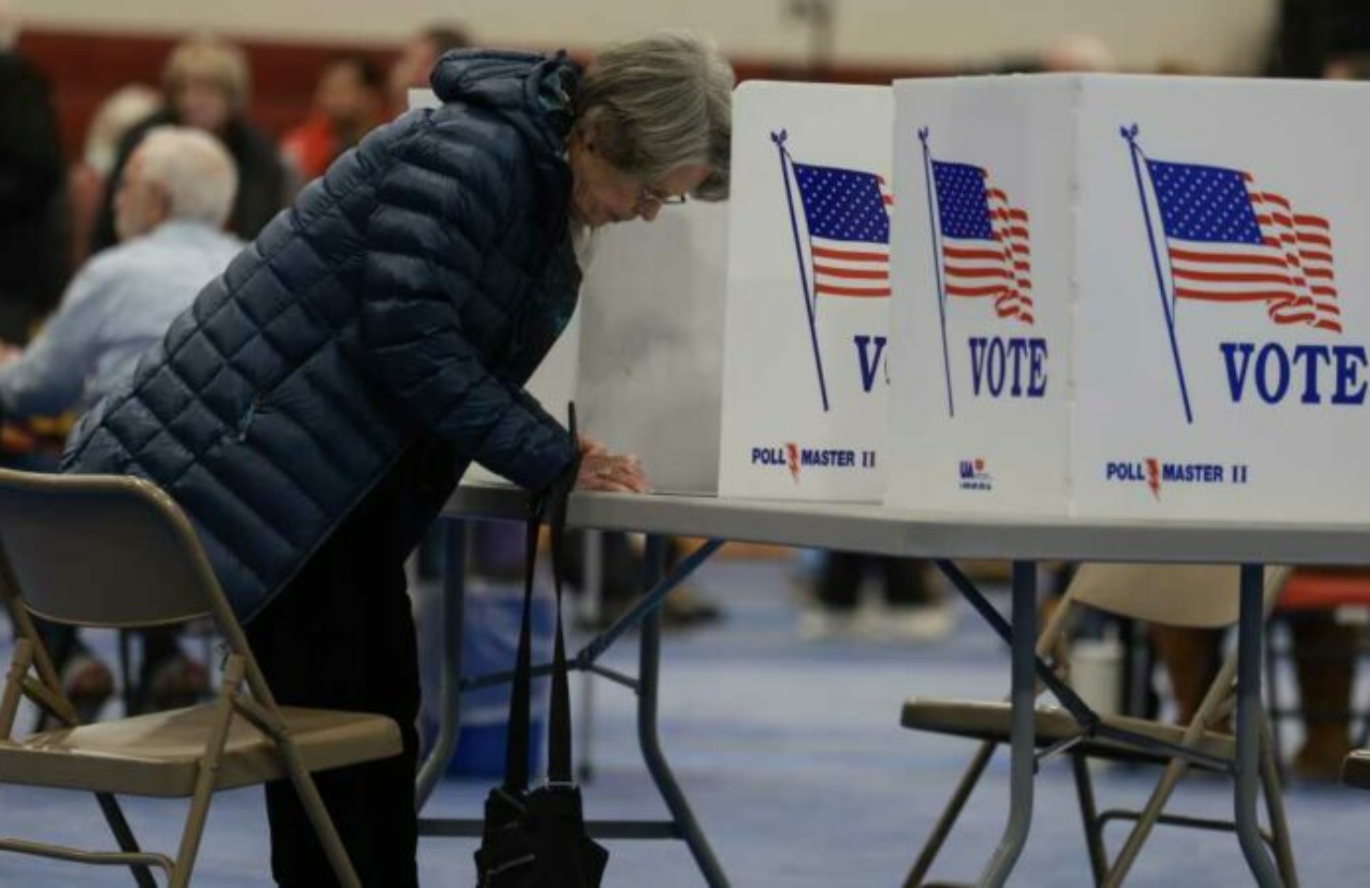 BEDFORD, NEW HAMPSHIRE - JANUARY 23: A voter fills out their ballot at a polling location at Bedford High School on January 23, 2024 in Bedford, New Hampshire. Voters headed to the polls as New Hampshire holds its primary. (Photo by Joe Raedle/Getty Images)