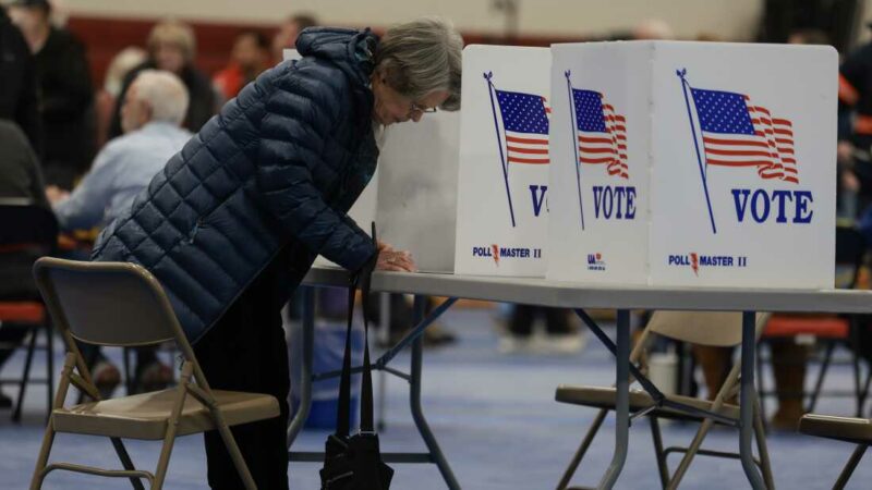 BEDFORD, NEW HAMPSHIRE - JANUARY 23: A voter fills out their ballot at a polling location at Bedford High School on January 23, 2024 in Bedford, New Hampshire. Voters headed to the polls as New Hampshire holds its primary. (Photo by Joe Raedle/Getty Images)