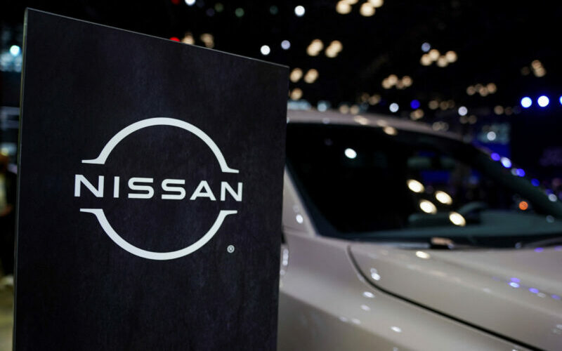 FILE PHOTO: A Nissan logo is seen next to a vehicle during the New York International Auto Show, in Manhattan, New York City, U.S., April 5, 2023. REUTERS/David 'Dee' Delgado